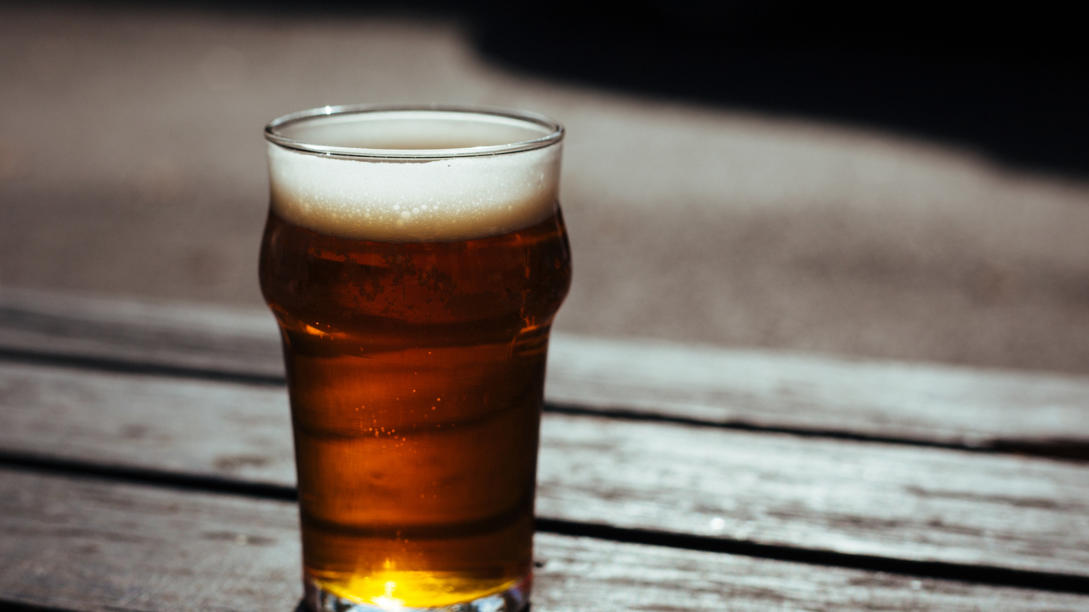 a pint of beer in the sunshine