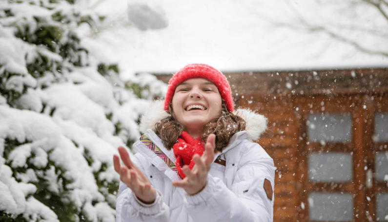 teenage girl in snow (keeping Christmas magic alive for older kids)