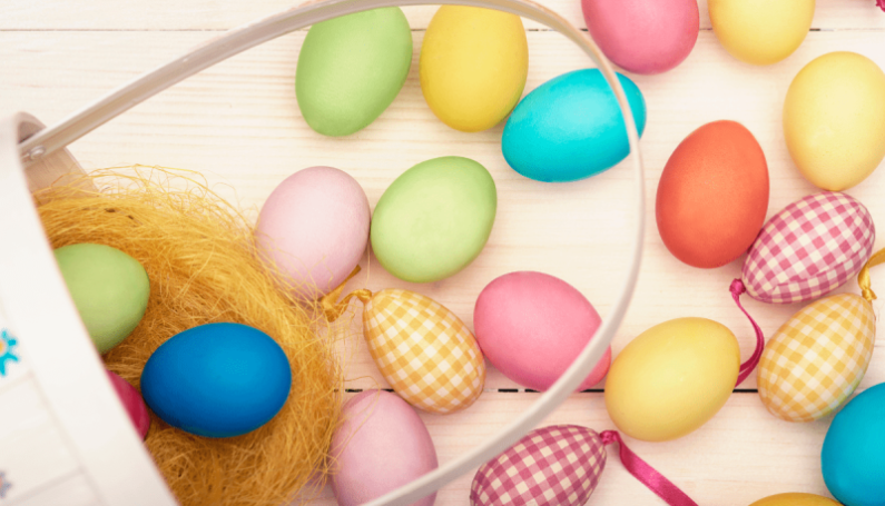 Easter basket with colored easter eggs