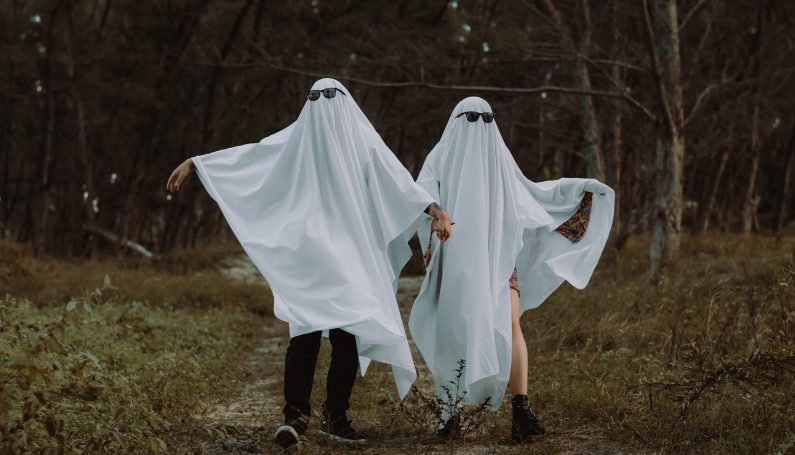 couple wearing ghost costumes (Boo! Favorite Spots Near Boston for a Haunted Date Night)