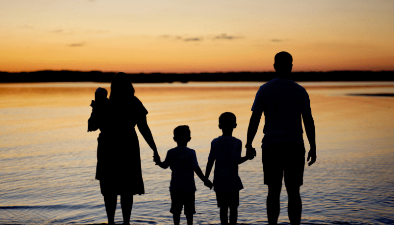 Family at beach, "18 summers mom"