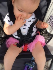 olivia in stroller sucking fingers