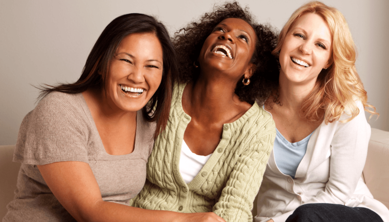 diverse group of women laughing together