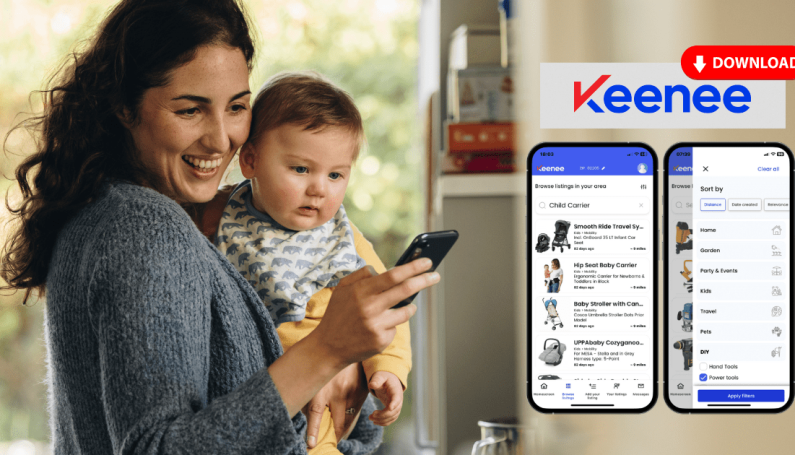 Mom looking at phone app with baby on hip