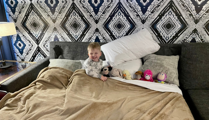 Little boy in pullout sofabed