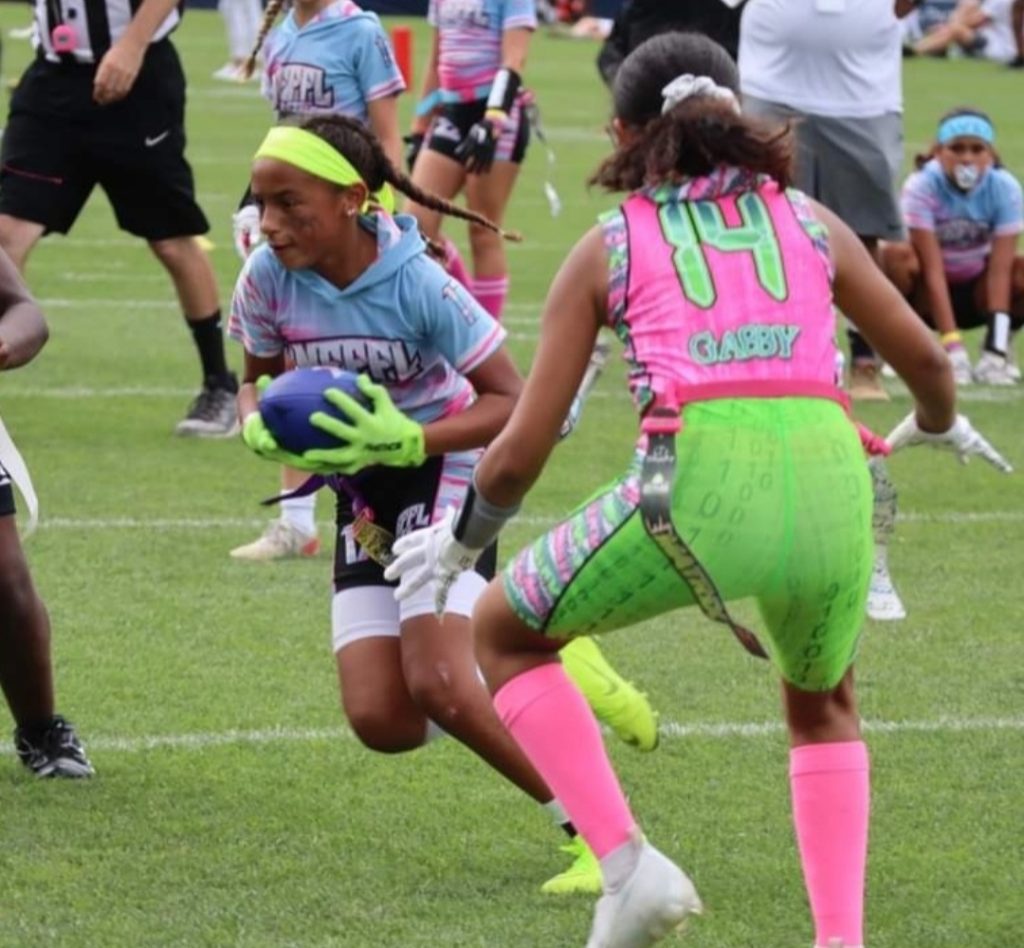 Girl playing flag football