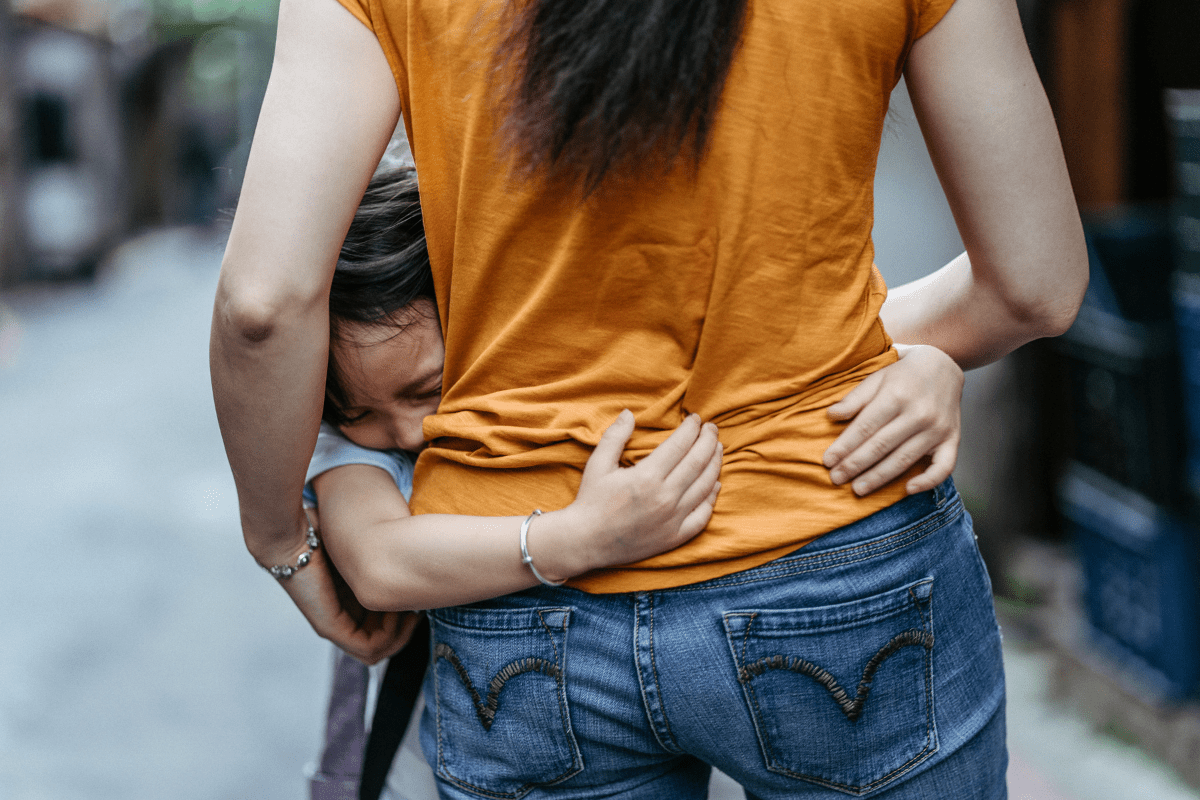 anxious child hugging anxious mother