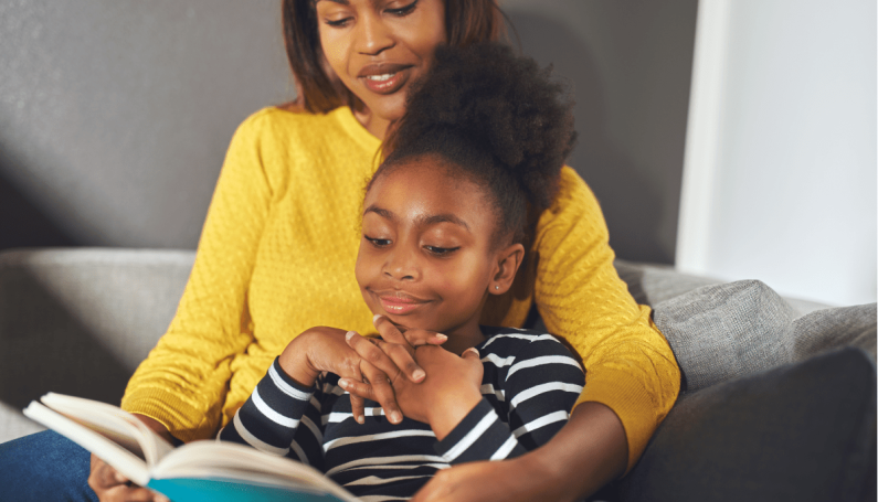 mom and daughter reading together, illustrating how Books can Teach Kids to Make the World a Better Place