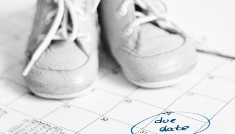 baby shoes on calendar with due date marked (lessons for my sister on becoming a new mom)