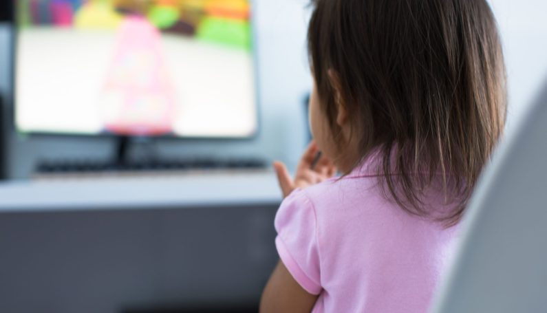 Young child watching tv (tv shows for kids that don't drive parents crazy)