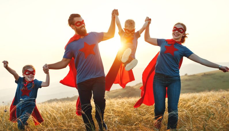 family dressed up as superheroes for Halloween (group or family costumes for Halloween)