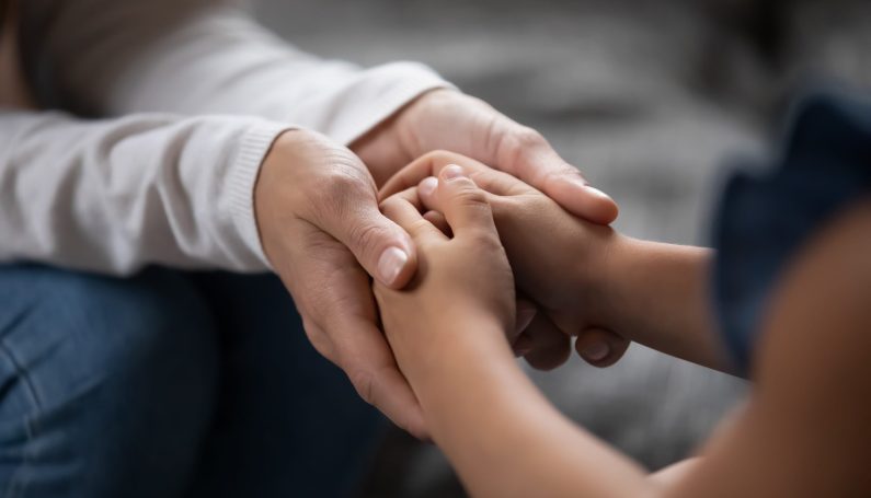 parent and child holding hands, lessons in grief from children