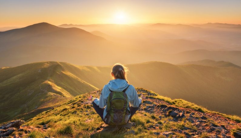 woman alone on mountain top (selfless mother)