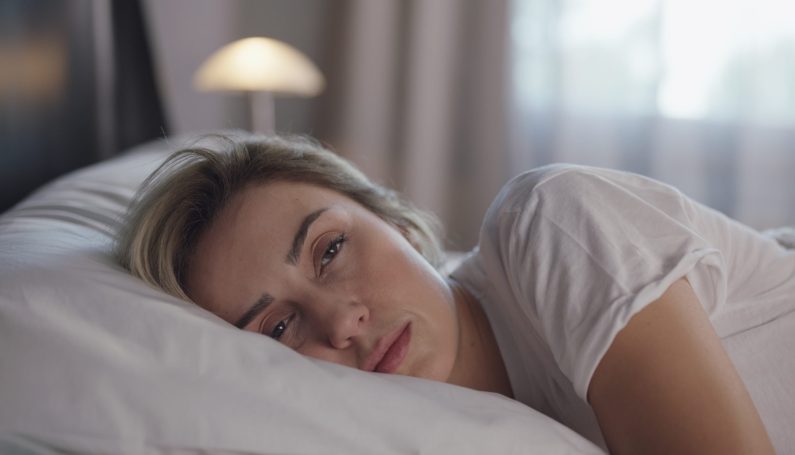 woman waking up too early, sleep deprived mom