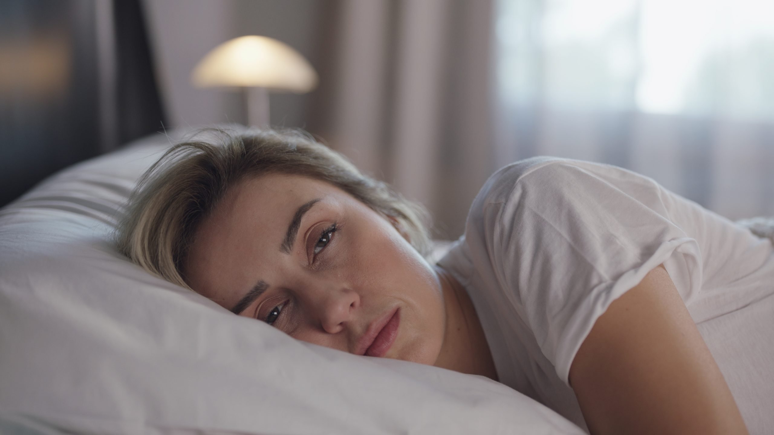woman waking up too early, sleep deprived mom