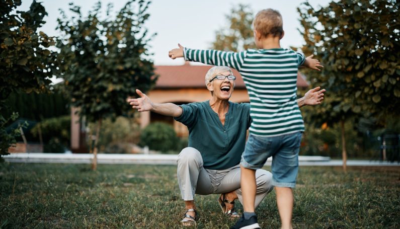 grandmother happily greeting grandson (grandparents day)