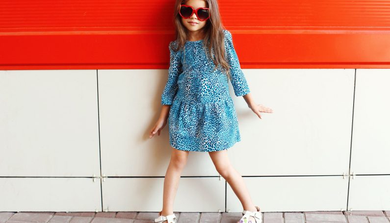 little girl model wearing sunglasses and leopard dress (girls clothes and self-respect)