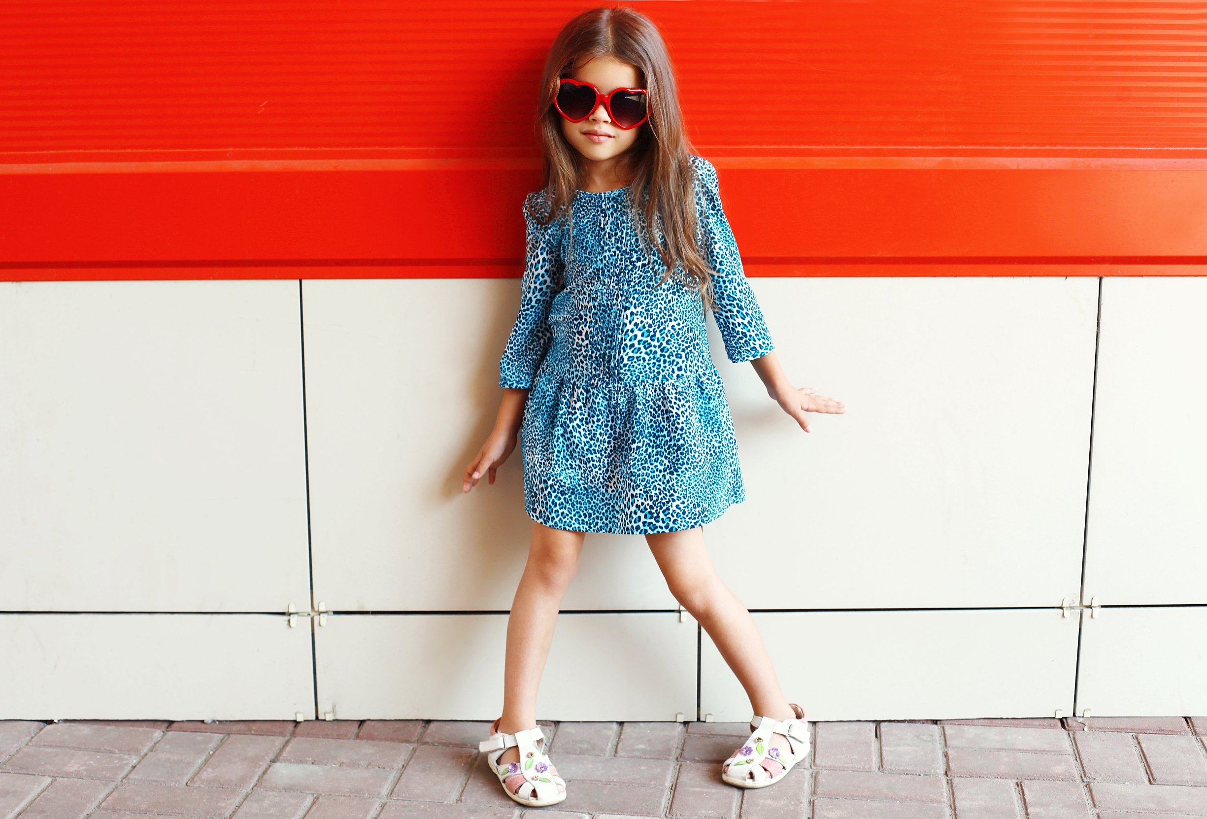 little girl model wearing sunglasses and leopard dress (girls clothes and self-respect)