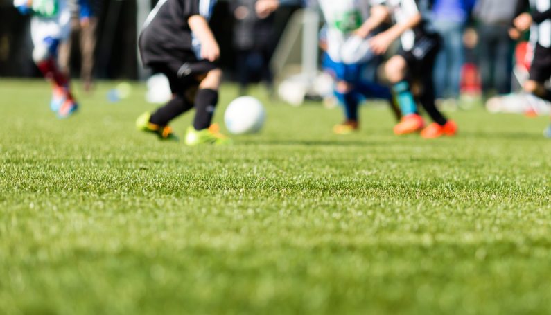 children playing soccer on a team (let town youth sports be bad, competitive kid sports)