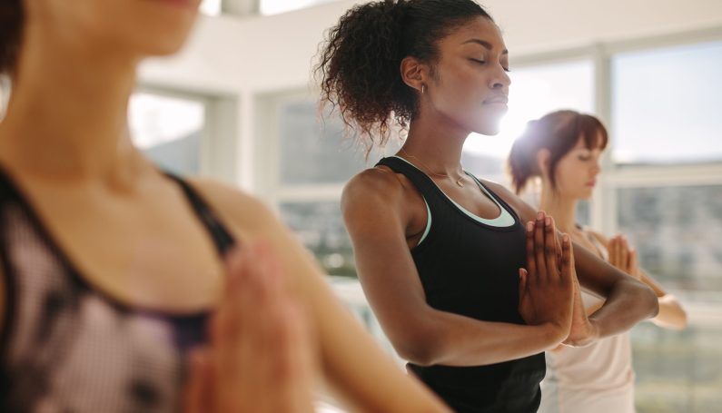 group of women doing yoga, fitness and exercise studios north of Boston