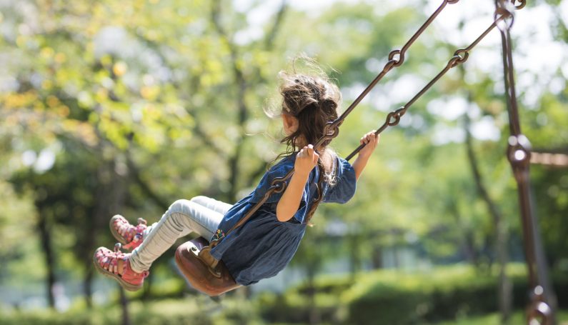 Little girl swinging (ADHD in girls)
