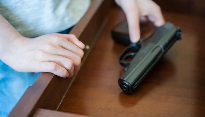 pistol in drawer at home (children and accidental gun death, parents keeping guns in the home during playdate)