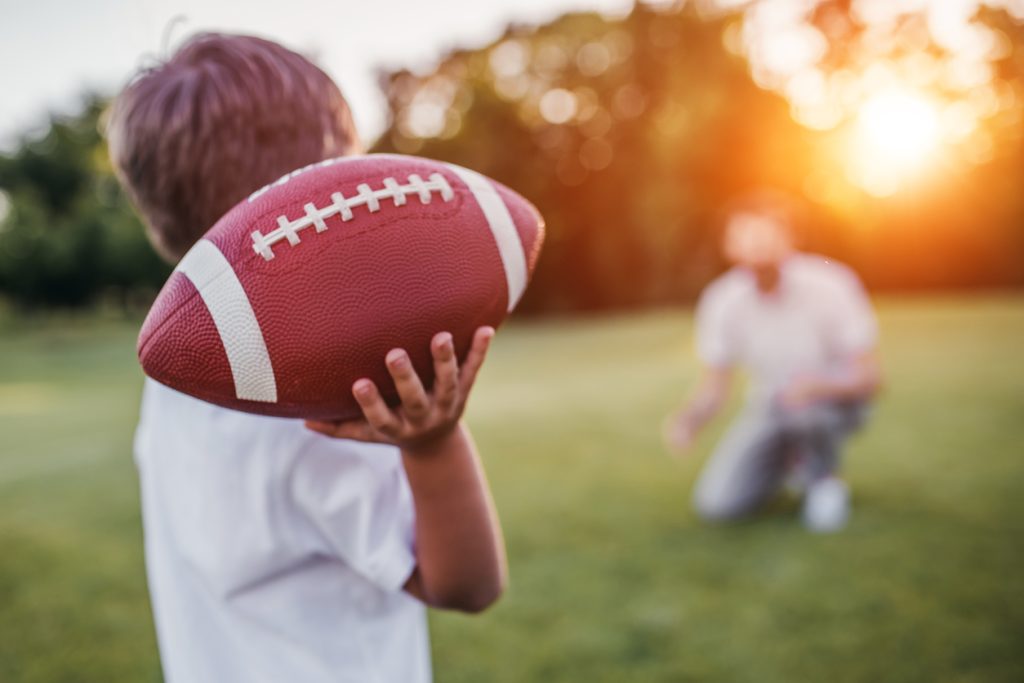 Child playing football