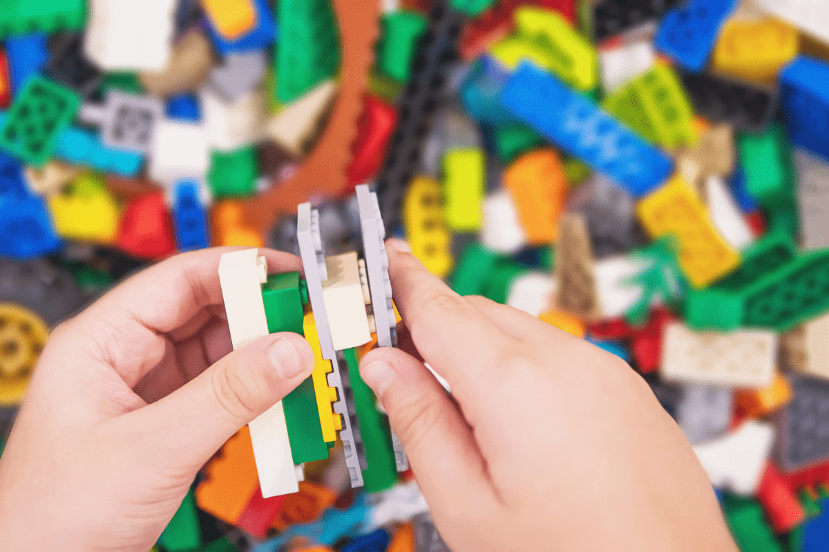 child playing with Legos