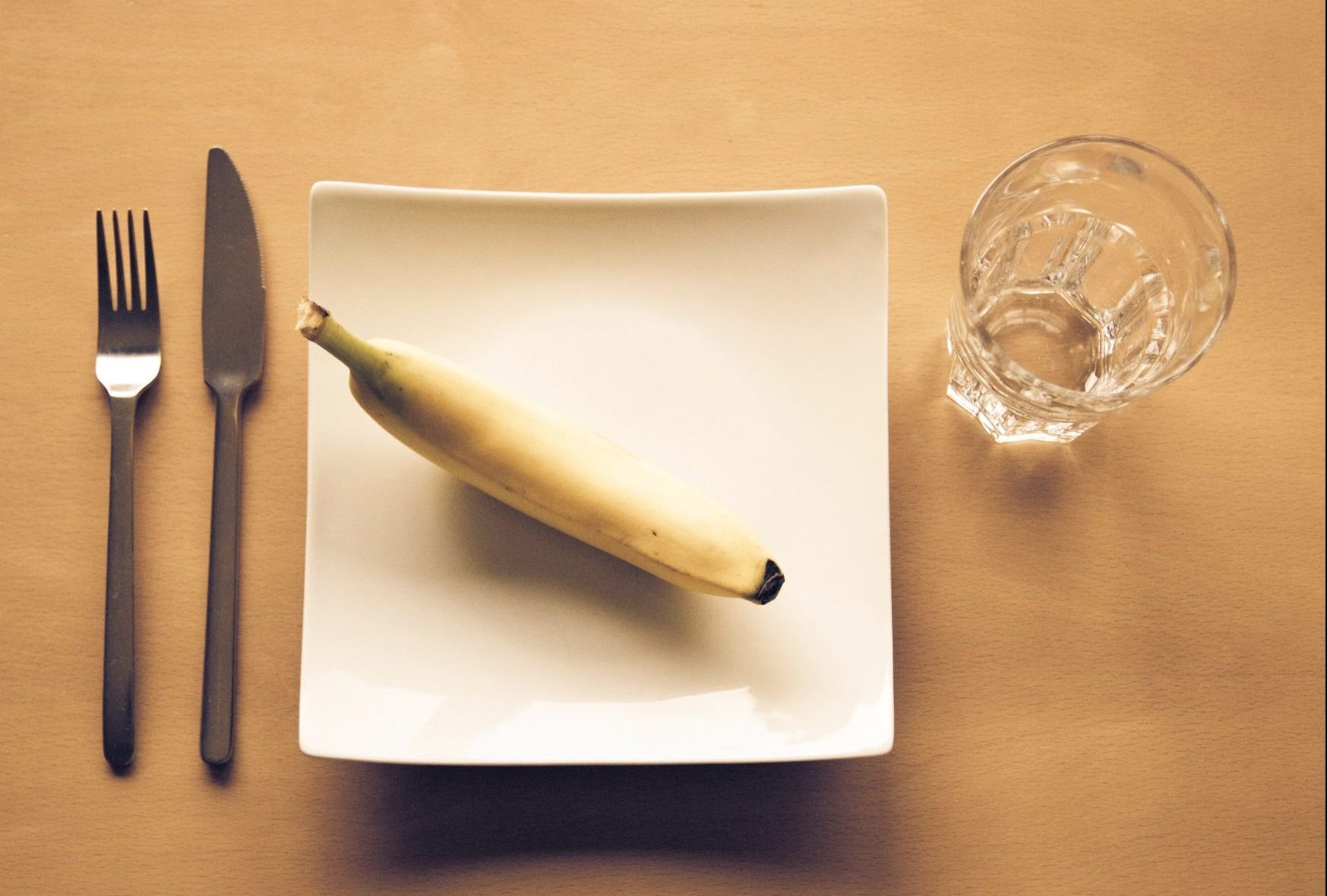 Banana on plate, diet culture