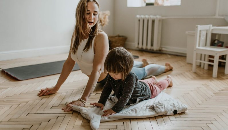 Mother and child doing yoga (lessons in yoga and parenting)