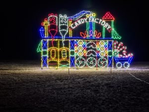 Outline of a candy factory in colored lights