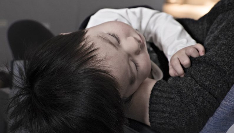 doctor - Boston Moms Blog - sick toddler in moms arms