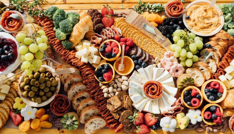 charcuterie board on wooden tabletop (charcuterie in Boston)