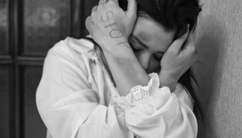 Woman covers her head