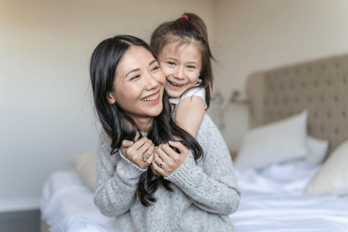 mom and daughter hugging (from working mom to stay-at-home mom)
